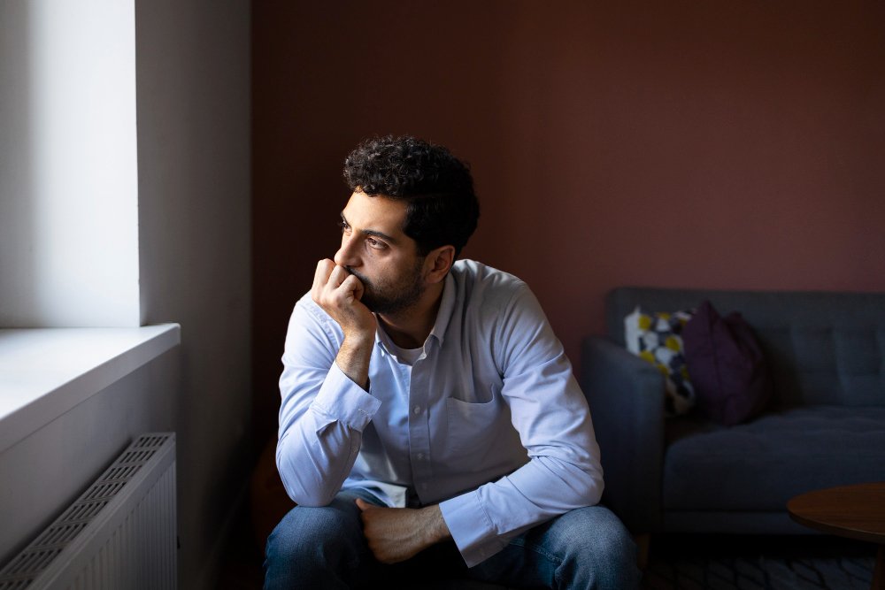 anxious-man-indoors-front-view